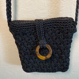 Nivida Black Woven Crossbody Bag with Faux Tortoise Ring Accent